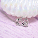 Silver necklace with a footprint and heart, set with zirconia.