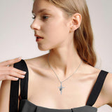 Silver Pendant with Footprints and a Cross