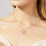 Silver necklace with a footprint and heart, set with zirconia.
