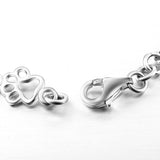 Silver bracelet with dog paw prints and a bone